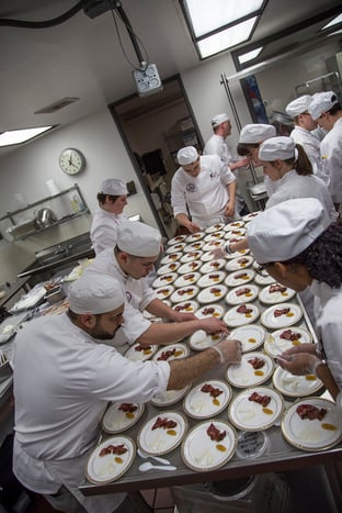 culinary_students_preparing_delicious_dish.jpg