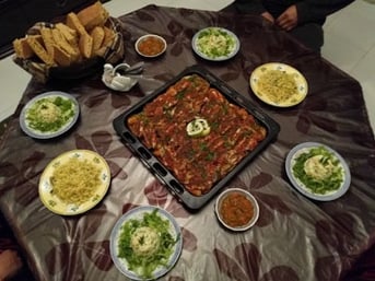 jjc students study abroad in morocco host family meal joliet junior college