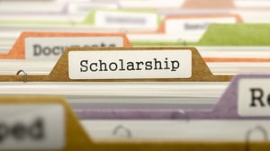 File Folder Labeled as Scholarship in Multicolor Archive. Closeup View. Blurred Image.-1