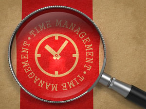 Magnifying Glass with Time Management Written Arround Icon of Clock Face on Old Paper with Red Vertical Line Background. Business Concept.